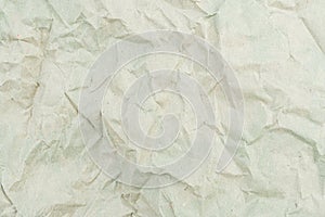 Close-up image of crumpled white paper with textures like torn fabric or uneven edges, symbolizing authenticity photo