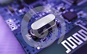 Close up image of crystal oscillator or electronic oscillator circuit.