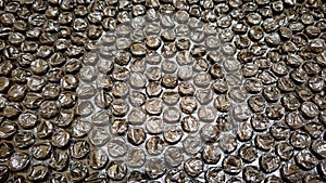 Dark Metallic Bubble Wrap Close-Up Texture for Packaging or Background
