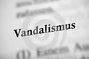 Close-up image of a dictionary open to a page with the word 'Vandalism' on it in German photo
