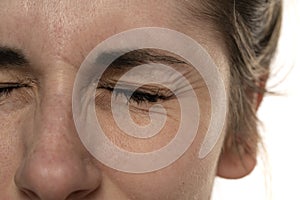 Close up image of female eye wrinkles