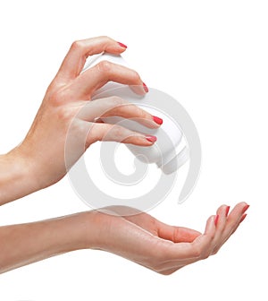 Close-up image of female hands adding talcum powder
