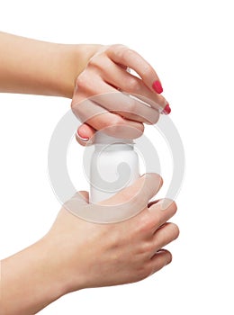 Close-up image of female hands adding talcum powder