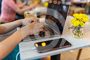 Close up image of female hands typing laptop keyboard