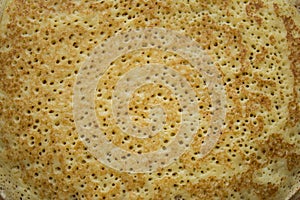 Close up image of fresh textured golden pancake as background