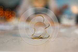 Close-up image of a gingerbread man on a kitchen countertop