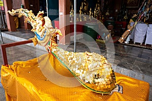 Close up image of gold sheet stick on holy golden gable apex statue in Thai temple. Publie Domain