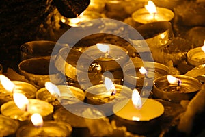 Mysticism, burning candles on a dark background. Foreground