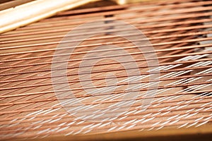 Close up image of interior of grand piano