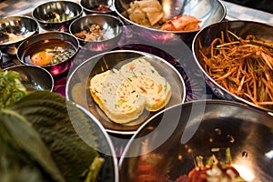 Close up image of Korean steamed eggs, with a lot of side dishes