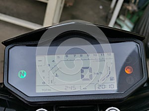 Close up image of motorcycle digital speedo meter.