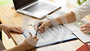 Close-up image of new landlord filling a housing rental form