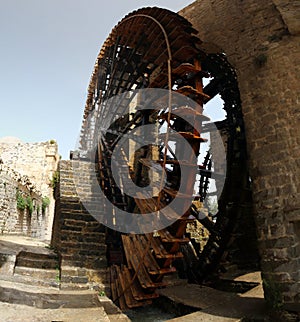 Close up image of a noria historic water wheel in syria photo