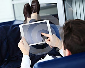 Close-up image of an office worker using a touchpad to analyze