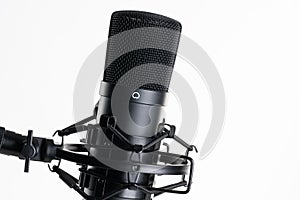 A close up image of proffesional studio microphone isolated on the white background