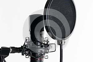 A close up image of proffesional studio microphone isolated on the white background