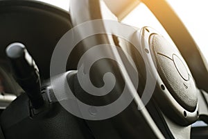 Close up image of racing performace steering wheel and horn