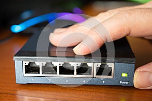 Close-up image of a router being put into service