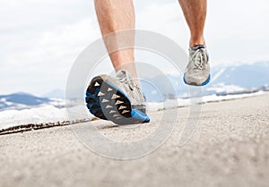 Close up image runner legs in running shoes