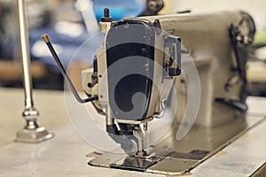 Close-up image of a sewing machine at the sewing workshop.