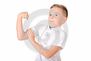 Close up image.The strong self-satisfied school boy on a white background shows the force
