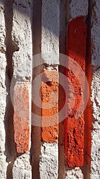 Textured Brick Wall with Orange Accents - Architectural Detail