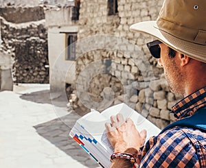 Close up image tourist with guide book on asian street