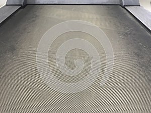 Close up image of an tread mill conveyor belt running in the tread mill for exercising purpose