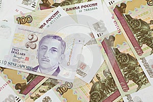 A two dollar bill from Singapore with Russian one hundred ruble bills