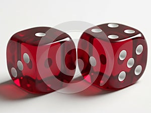 Two red dice rolling on a white surface
