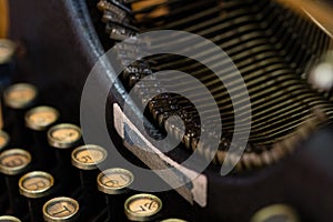 A Close-up image of a vintage typewriter Keyboard and Striker bar assembly