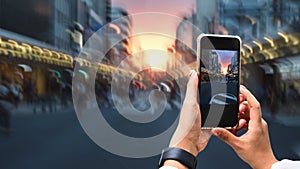 Close up image of woman hands taking a photo by use her smartphone.