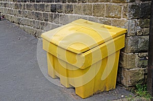 Close up image of yellow grit box