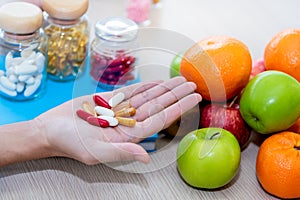 Close up images of nutritionists are showed Vitamin pills photo