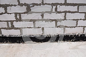 Close up on Important Waterproofing Options for Concrete Foundations.