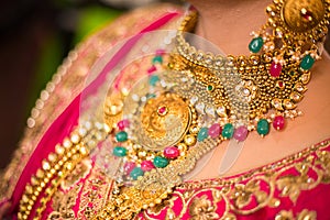 Close up of indian bride wearing gold necklace