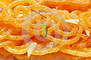 Close-Up of Indian Classical  Sweet Jalebi . Garnished with kesar Saffron and dry nuts, Jalebi is one of the most delicious