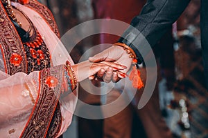 Close up of Indian couple`s hands at a wedding