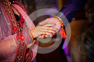 Close up of Indian couple`s hands at a wedding