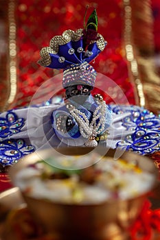 Close-up of indian home temple during the birthday celebration of Lord Krishna  Janmashtami  with puja thali and kheer  khir