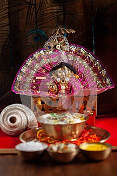 Close-up of indian home temple during the birthday celebration of Lord Krishna  Janmashtami  with puja thali and kheer  khir