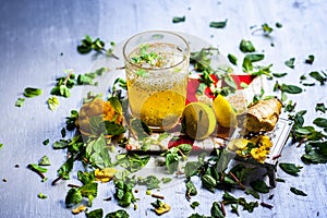 Close up of INDIAN popular summer drink JAGGERY SHRABAT/gud ka shrabat with all its ingredients i.e. lemon,ginger juice, soaked