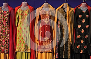 Indian woman fashion embroidered salwar kameez  in shop display photo