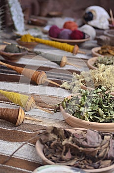 Close up of indigenous dyeing and weaving implements in Peru