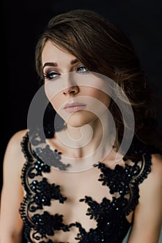 Close up. Individuality. Thoughtful Elegant Lady in Black Prom Evening Dress. Studio retouched photo.