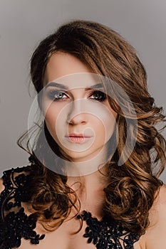 Close up. Individuality. Thoughtful Elegant Lady in Black Prom Evening Dress. Studio retouched photo.