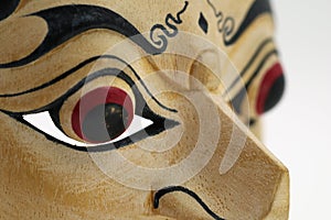 Close up of Indonesian mask, topeng, maschera on white background photo