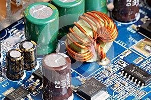 Close-up of inductors, capacitors and chips