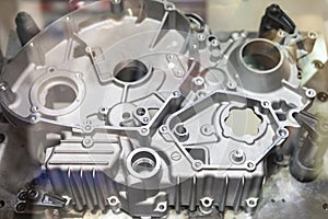 Close up Industrial aluminum casting parts cover crankcase or cylinder block of vehicle automobile or motorcycle set up on work