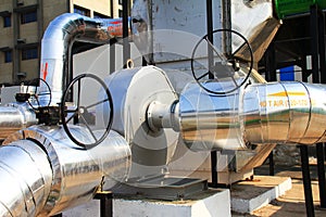 Close up of a industrial hot air pipe connected to